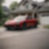 A modern car parked in front of a suburban home