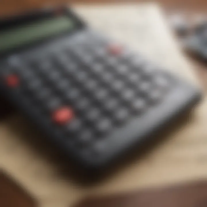 A close-up view of a calculator with financial documents, illustrating the calculation of insurance premiums.